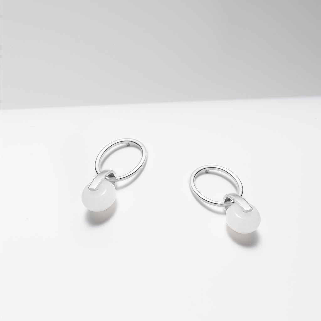 Gold plated hoop earrings with dangling white jade stone