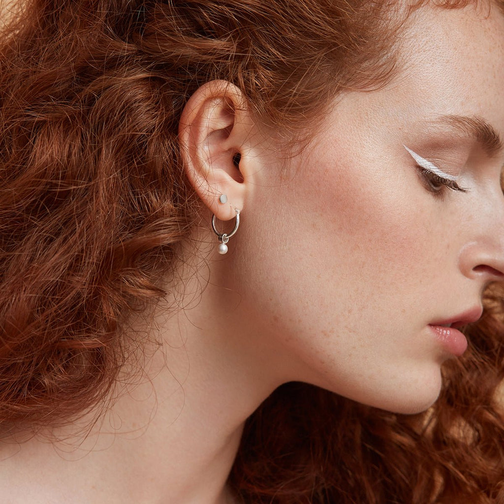 Hoop earrings with hanging pearl