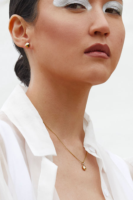 Small round minimalist earrings and pendant necklace by Montreal Jewelry designer Veronique Roy
