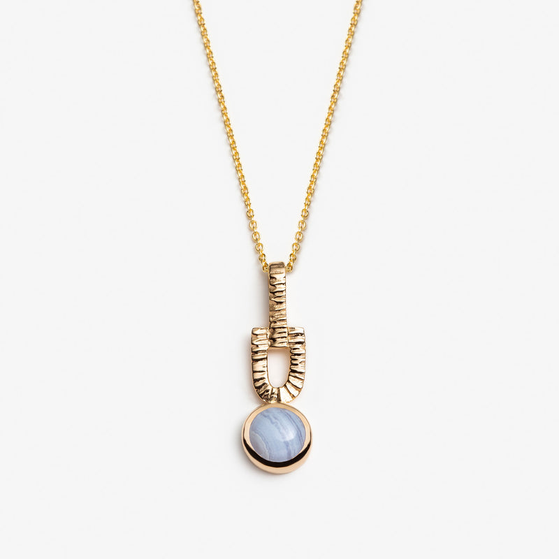 gold necklace blue stone