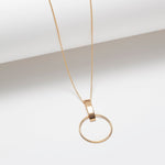 Long gold plated circle and vertical bar pendant necklace