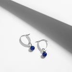Triangle sterling silver hoop earrings with lapis lazuli charms