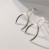 Big geometric silver earrings by Montreal jewelry designer Veronique Roy