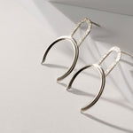 Big geometric silver earrings by Montreal jewelry designer Veronique Roy