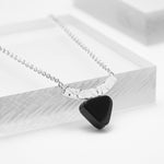 Sterling silver curved bar chain necklace with a triangle black onyx stone