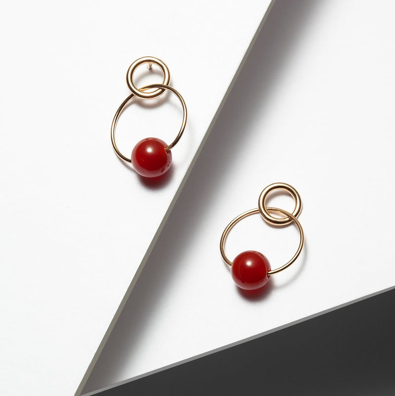 gold plated silver minimlalist hoop earrings with red carnelian stones