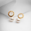 Small gold earrings with natural pearls