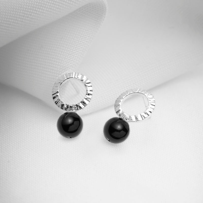 Hammered silver open circle earrings with black stones