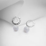 Small silver circle earrings with blue agate stones