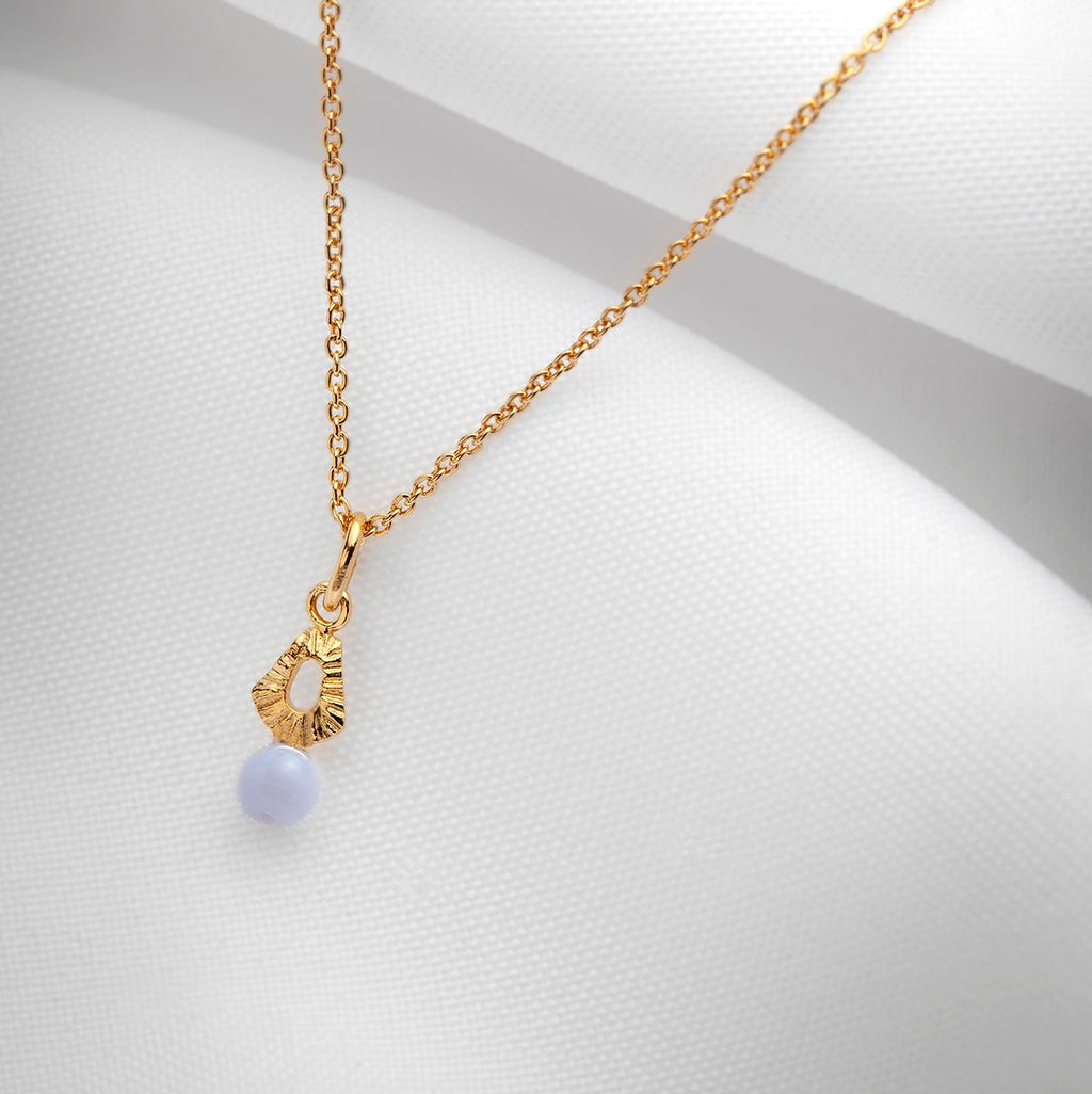 Handmade gold charm necklace with blue lace agate agate