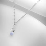 Silver charm necklace with tiny blue lace agate stone