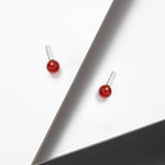 Simple sterling silver earrings with red stones