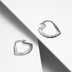 Sterling silver geometric hoop earrings with linear texture