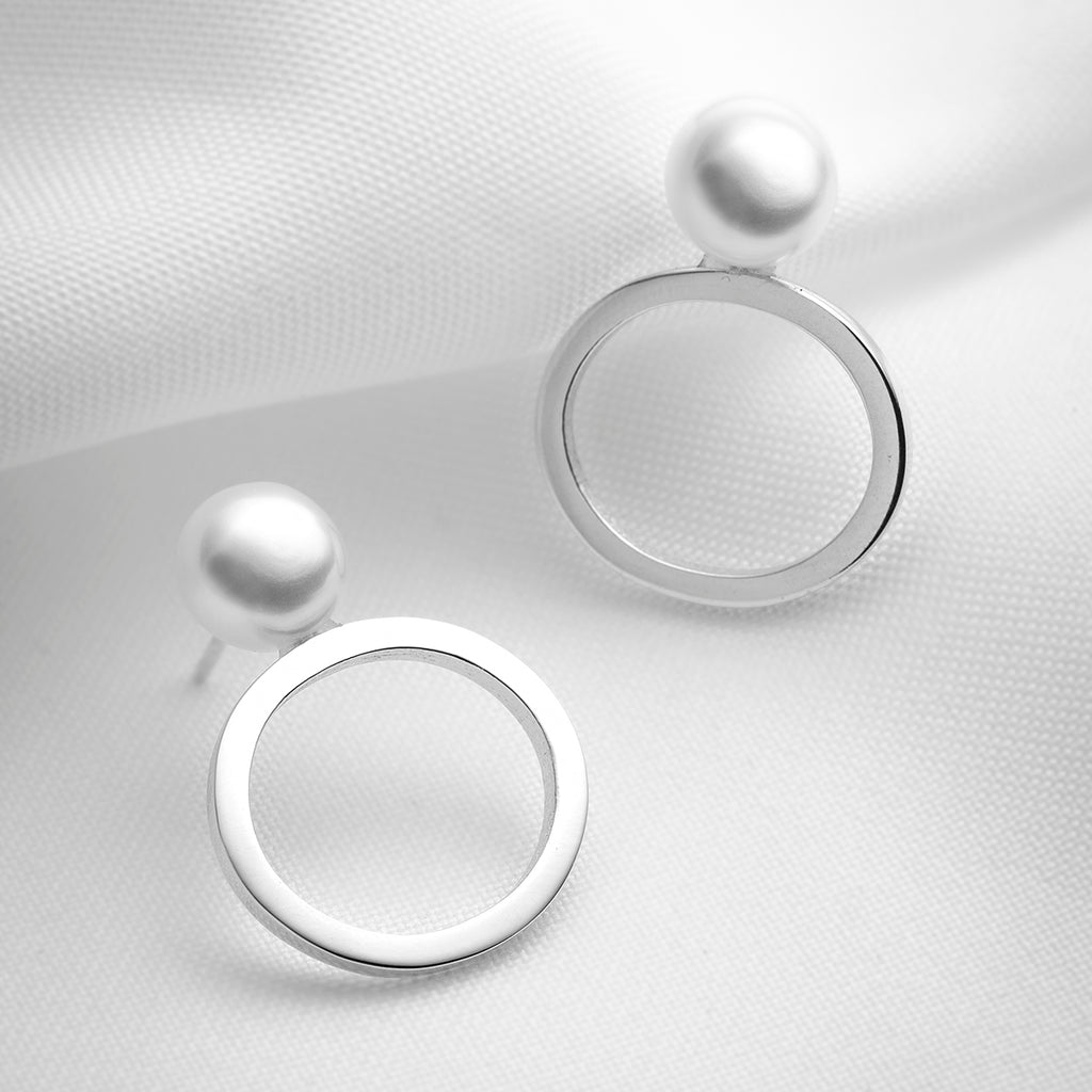 Nix, big pearl button stud earrings with oval shapes