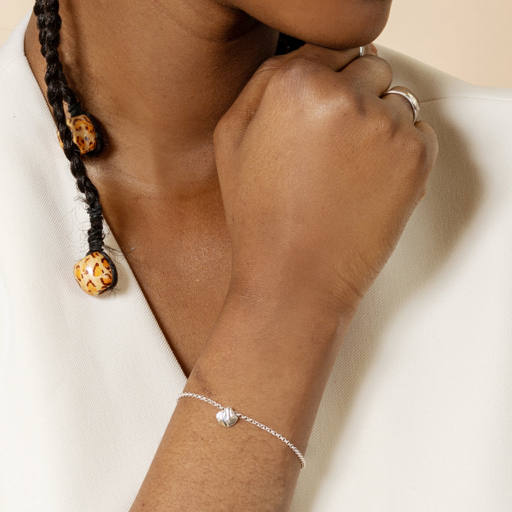 thin chain bracelet in silver with charm