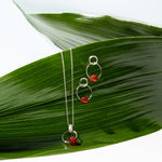 Silver matching pendant and earrings with red carnelian stone