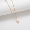 Gold plated rose quartz circle and bar pendant necklace
