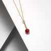 Delicate gold plated silver stem necklace with red carnelian stone