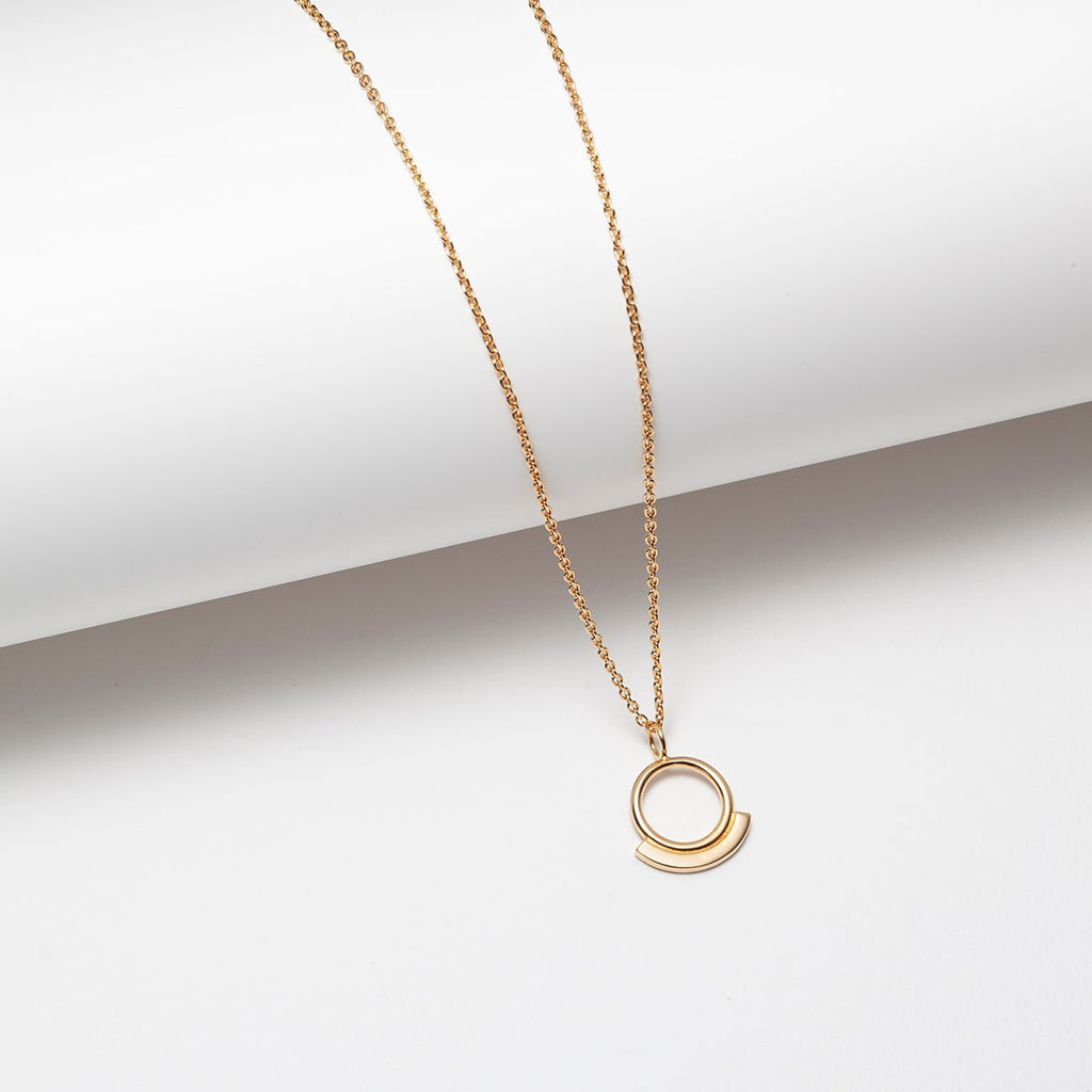 Modern small open circle charm necklace on short chain in 14k gold plated silver
