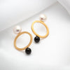 Gold plated open oval earrings with large pearls and black onyx stones