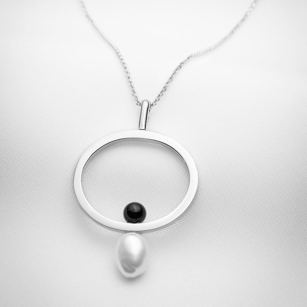 Sterling silver long pendant necklace with a single baroque pearl and black onyx