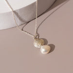 Silver charm necklace with freaswater pearl
